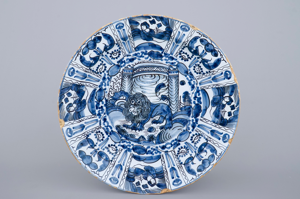 A good Dutch Delft blue and white chinoiserie dish with a lion, 17/18th C.